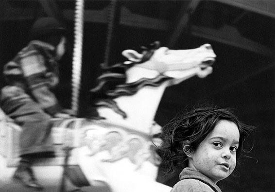 Harold Feinstein, Gypsy girl with Carousel, Coney Island, NY