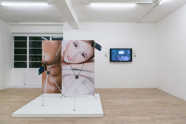 Timur Si-Qin, 'Deliver me from dipolar spirits' (2014); Neil Beloufa, 'Kempinski' video (2007). Fulfilment Centre installation view at The Sunday Painter (2014). Image courtesy the gallery.